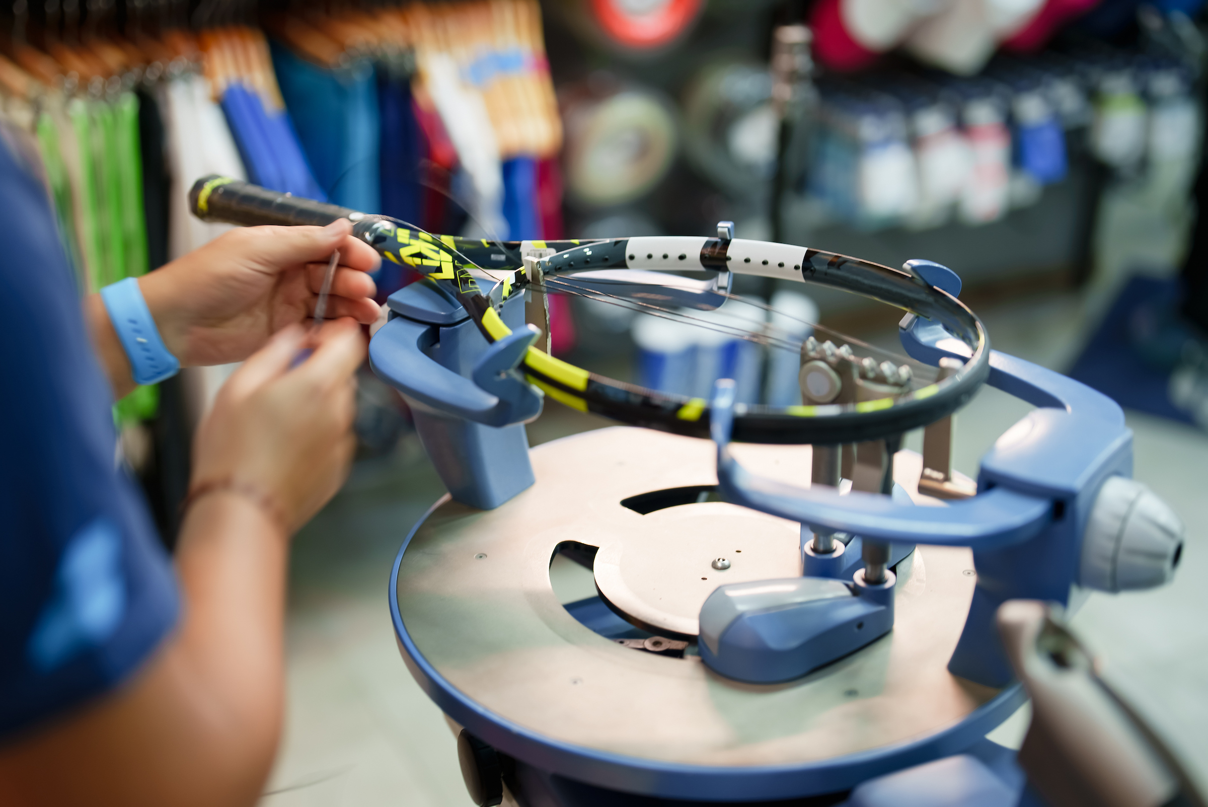 Tennis racquet fitting.