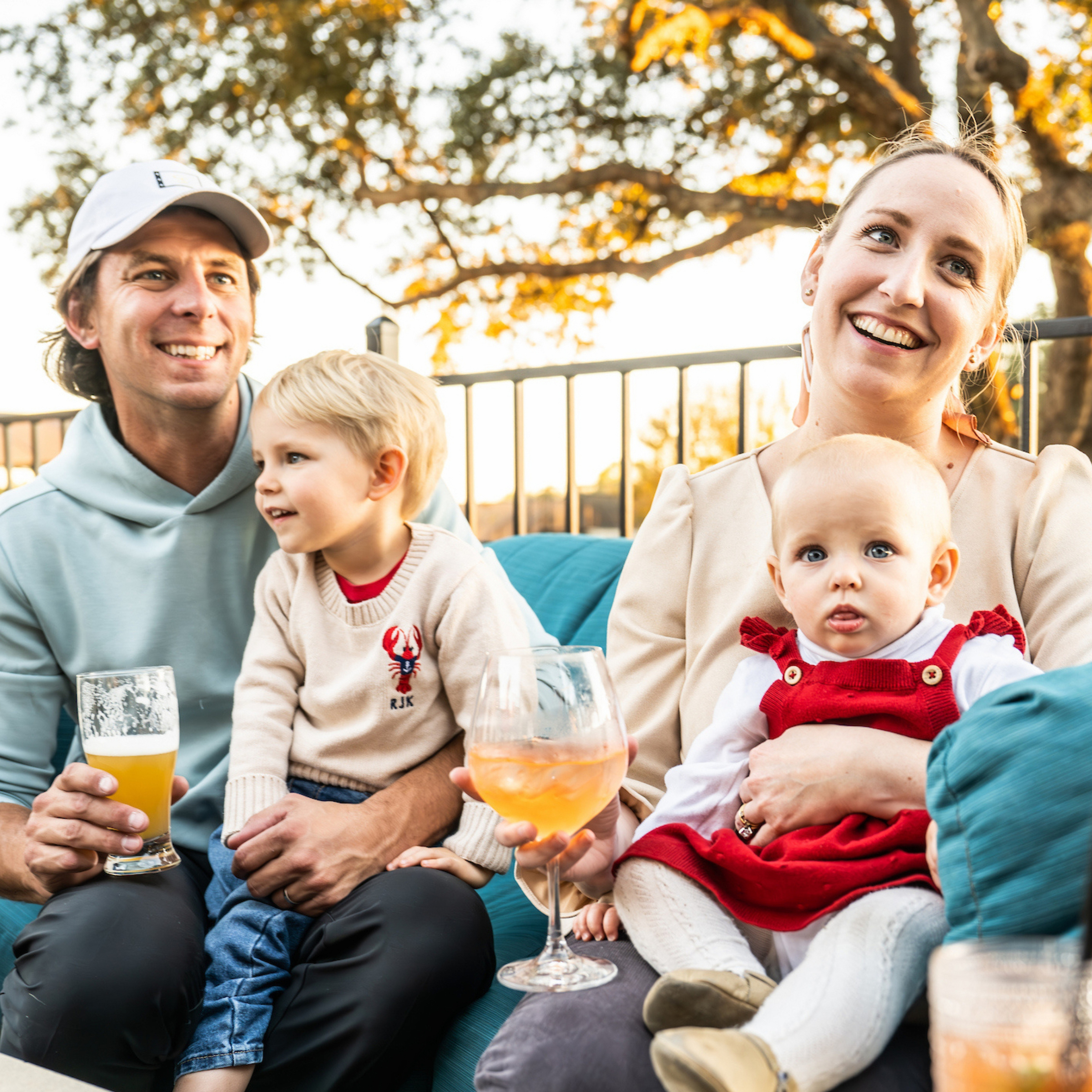 Two parents with kids in their lap.